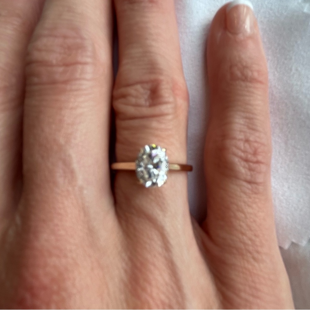 10k yellow gold band. 4 prong, 1.5ct oval moissanite. Size 5.5